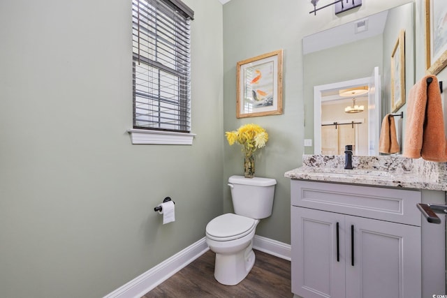 1028 Whooping Crane Dr, Conway, SC 29526 - half bath featuring baseboards, wood finished floors, toilet, and vanity