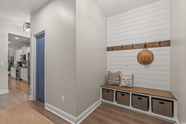 mudroom featuring recessed lighting, baseboards, and dark wood finished floors