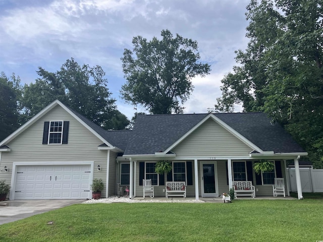 113 Edwards Ln, Longs, SC 29568 - view of front facade with a porch, roof with shingles, driveway, and a garage
