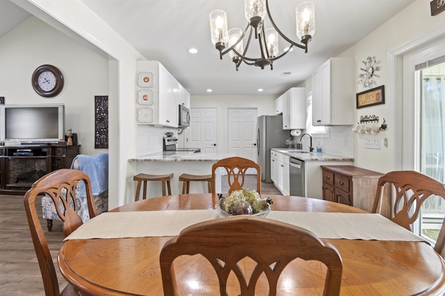 113 Edwards Ln, Longs, SC 29568 - dining area featuring wood finished floors, a chandelier, and recessed lighting