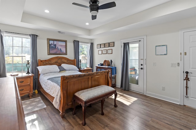 113 Edwards Ln, Longs, SC 29568 - bedroom with a tray ceiling, wood finished floors, baseboards, recessed lighting, and access to outside