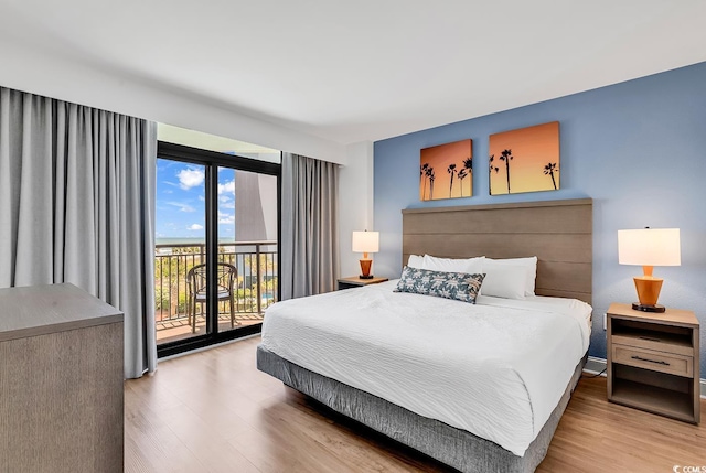 7100 N Ocean Blvd Unit 317, Myrtle Beach, SC 29572 - bedroom with access to outside and wood finished floors