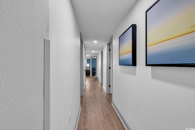 7100 N Ocean Blvd Unit 317, Myrtle Beach, SC 29572 - corridor with recessed lighting, wood finished floors, baseboards, and a textured wall