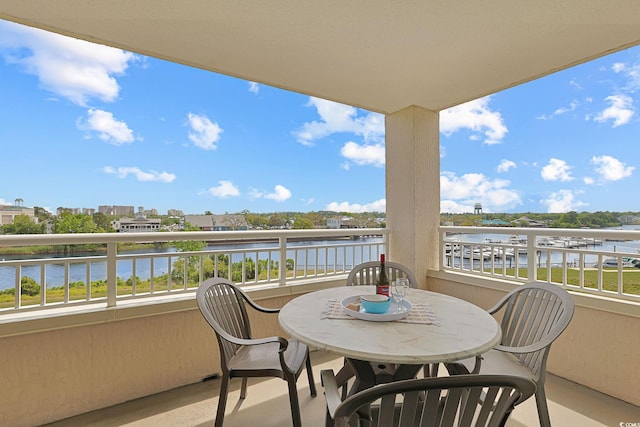 balcony featuring a water view