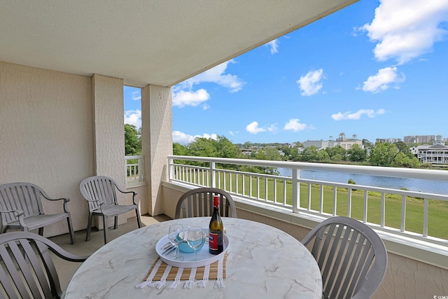 balcony featuring outdoor dining space
