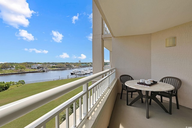 balcony featuring a water view