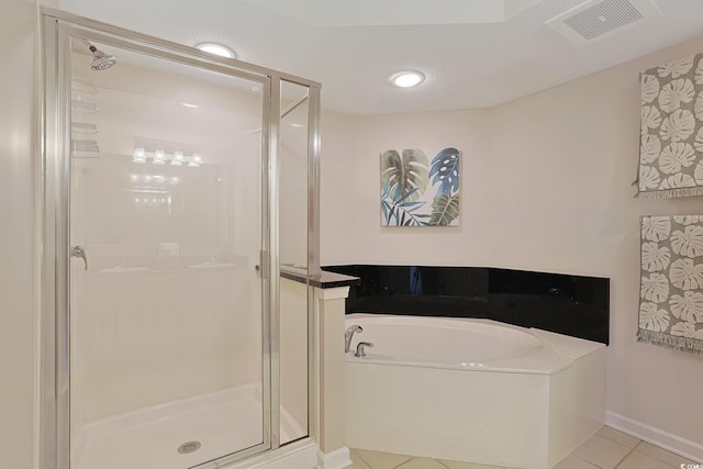 full bath featuring visible vents, a garden tub, tile patterned floors, and a shower stall