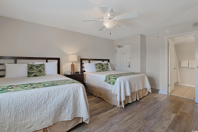 bedroom with baseboards, a ceiling fan, and wood finished floors