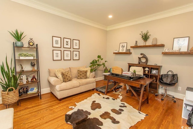 office area featuring light wood-style floors, baseboards, ornamental molding, and recessed lighting