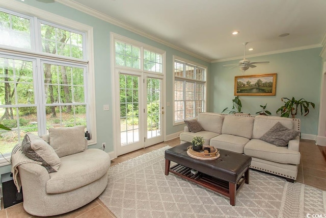 living area with crown molding, baseboards, ceiling fan, and recessed lighting