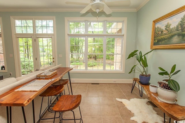 sunroom featuring french doors, plenty of natural light, and visible vents