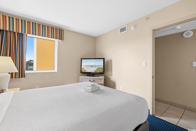 2000 N Ocean Blvd Unit 301, Myrtle Beach, SC 29577 - tiled bedroom with baseboards