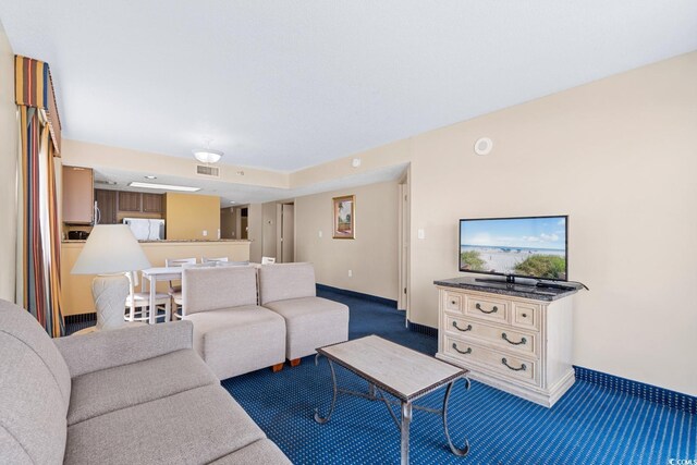 2000 N Ocean Blvd Unit 301, Myrtle Beach, SC 29577 - carpeted living room featuring baseboards