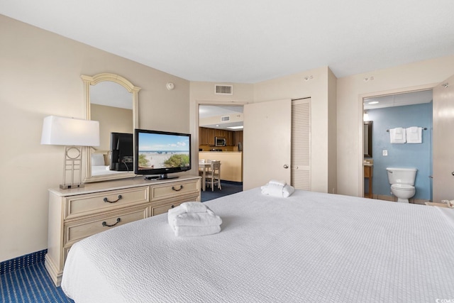 2000 N Ocean Blvd Unit 301, Myrtle Beach, SC 29577 - carpeted bedroom with ensuite bath, a closet, and baseboards