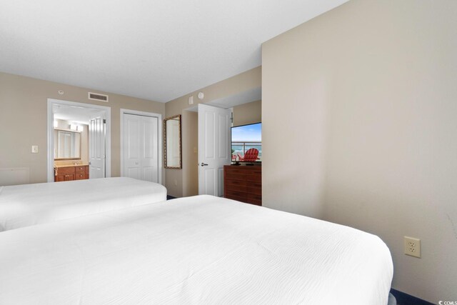5200 N Ocean Blvd Unit 833, Myrtle Beach, SC 29577 - bedroom with ensuite bathroom, a closet, and visible vents