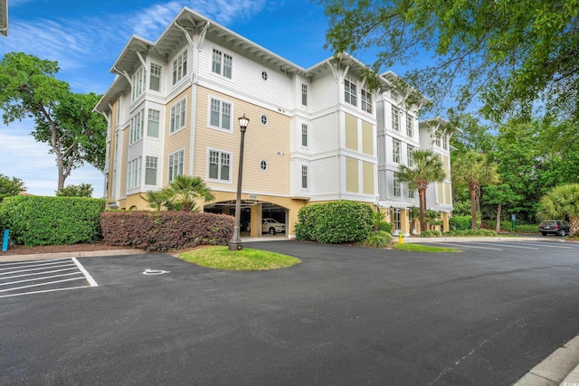 view of property featuring uncovered parking