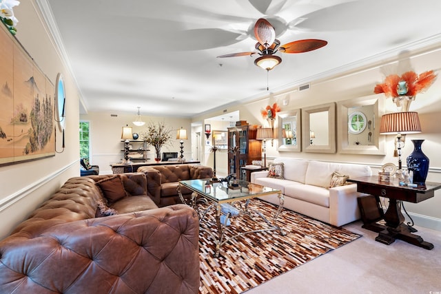 carpeted living room featuring crown molding and ceiling fan