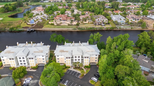 aerial view of residential area featuring a nearby body of water