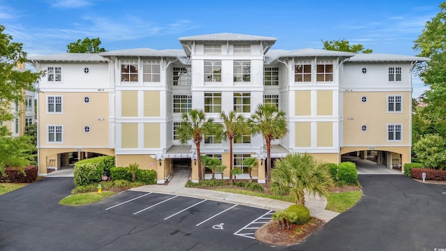 view of property with uncovered parking