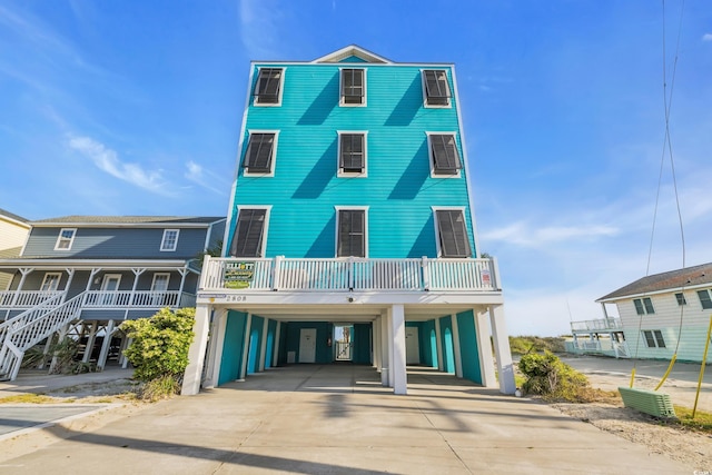 2808 N Ocean Blvd, North Myrtle Beach, SC 29582 - view of front of home with driveway and a carport