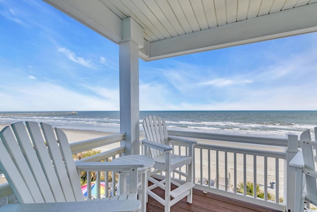 2808 N Ocean Blvd, North Myrtle Beach, SC 29582 - wooden deck featuring a view of the beach and a water view