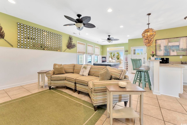 2808 N Ocean Blvd, North Myrtle Beach, SC 29582 - living area with light tile patterned floors, a wainscoted wall, a ceiling fan, and recessed lighting
