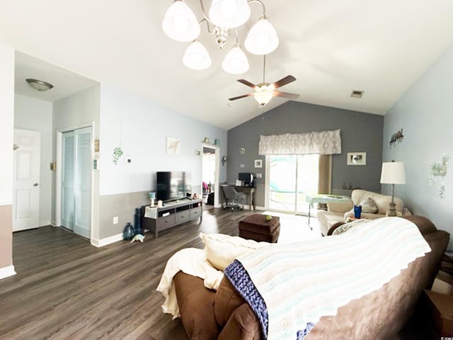 bedroom featuring baseboards, wood finished floors, vaulted ceiling, and access to exterior