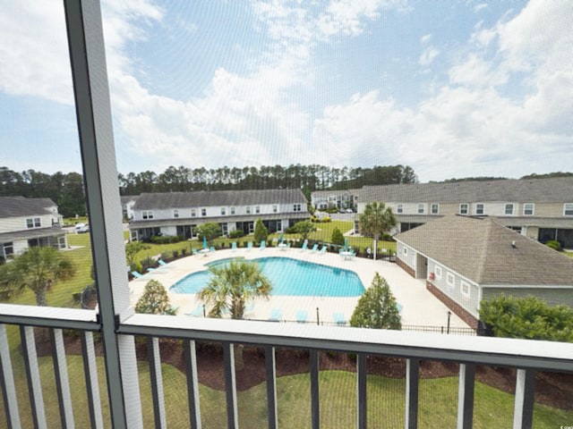 community pool featuring a patio area