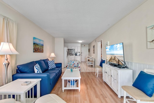 6302 N Ocean Blvd Unit G-3, North Myrtle Beach, SC 29582 - living area featuring light wood finished floors and a textured ceiling