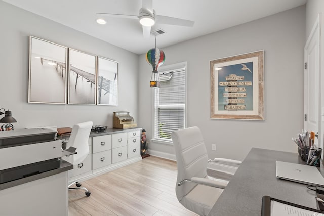 home office featuring light wood-style flooring, a ceiling fan, baseboards, recessed lighting, and visible vents
