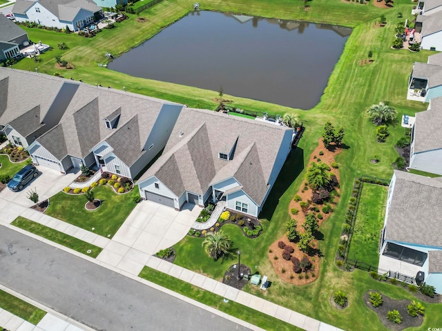 aerial view featuring a water view and a residential view