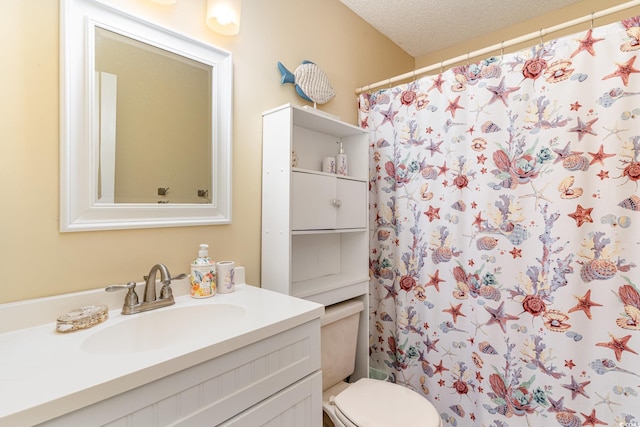 3700 Golf Colony Ln Unit 21B, Little River, SC 29566 - bathroom with vanity, toilet, a shower with shower curtain, and a textured ceiling