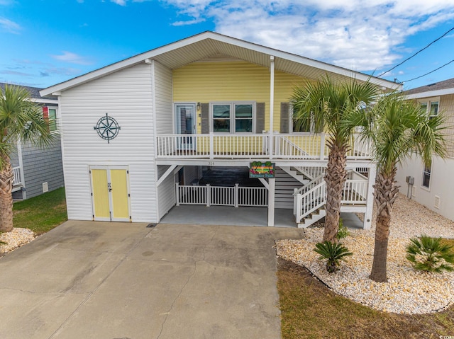 coastal inspired home with concrete driveway
