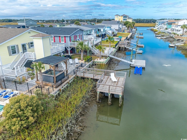aerial perspective of suburban area with a nearby body of water