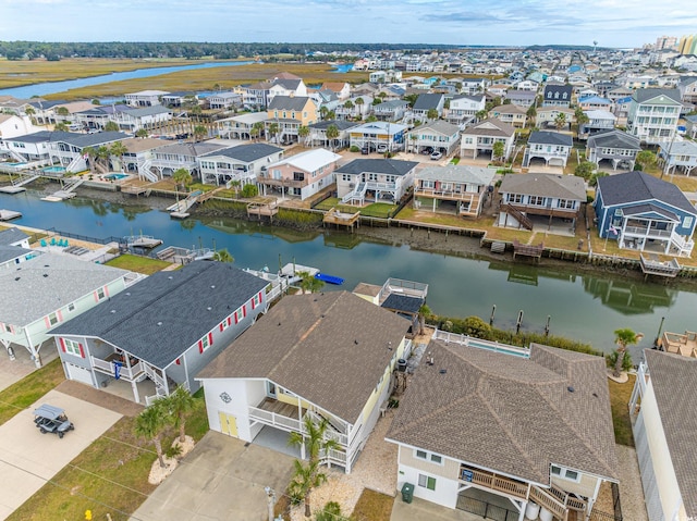 aerial perspective of suburban area featuring a nearby body of water