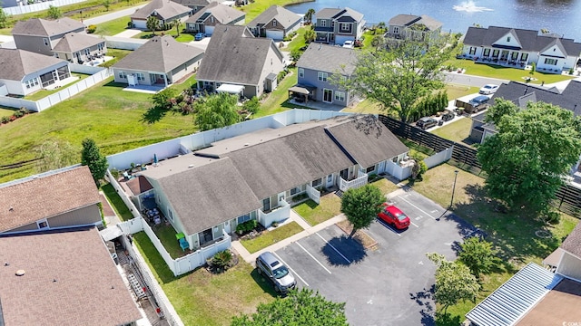 bird's eye view with a water view and a residential view