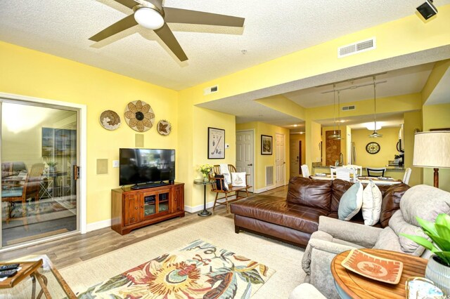 1401 Lighthouse Dr Unit 4226, North Myrtle Beach, SC 29582 - living area with visible vents, track lighting, and wood finished floors