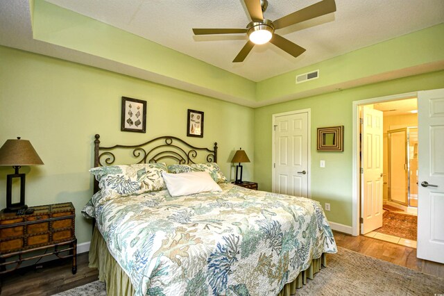 1401 Lighthouse Dr Unit 4226, North Myrtle Beach, SC 29582 - bedroom featuring ensuite bath, a ceiling fan, baseboards, wood finished floors, and visible vents