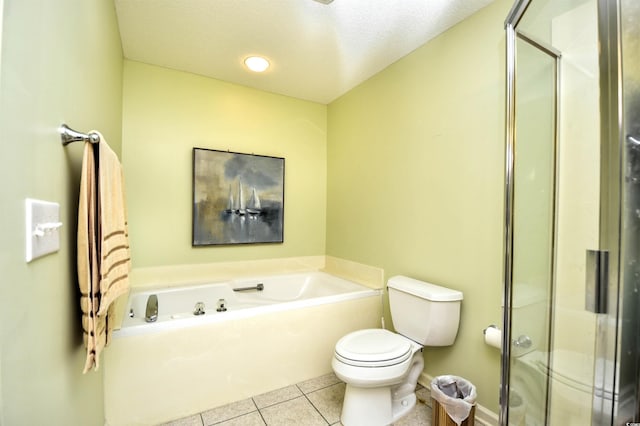 bathroom featuring toilet, a shower stall, tile patterned flooring, and a garden tub