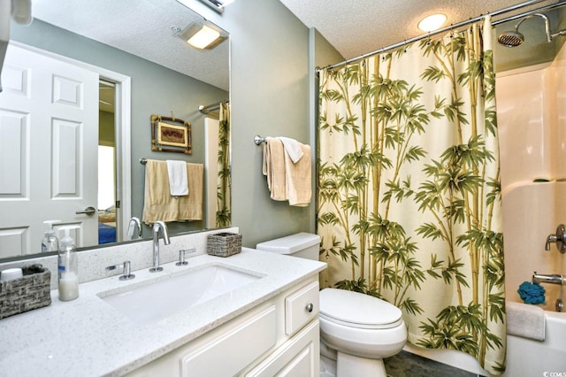 full bathroom with vanity, a textured ceiling, shower / bath combo with shower curtain, and toilet