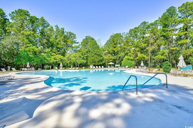 community pool with a patio area