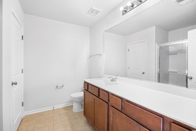 full bathroom featuring vanity, toilet, visible vents, and a stall shower