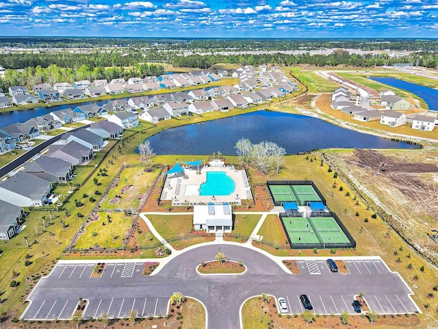 aerial view with a water view and a residential view