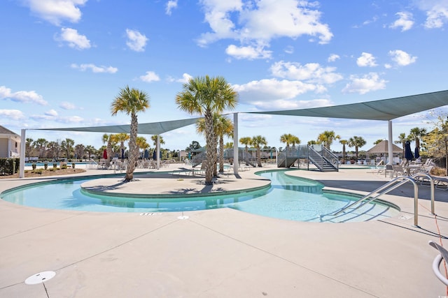 pool with a patio area