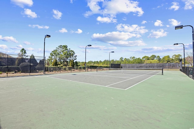 view of sport court featuring fence and community basketball court