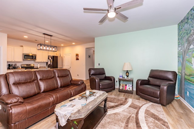 40 Parkside Dr, Pawleys Island, SC 29585 - living room with light wood finished floors, ceiling fan, baseboards, and recessed lighting