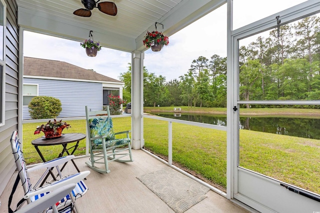 40 Parkside Dr, Pawleys Island, SC 29585 - sunroom / solarium featuring a water view, a ceiling fan, and view of scattered trees