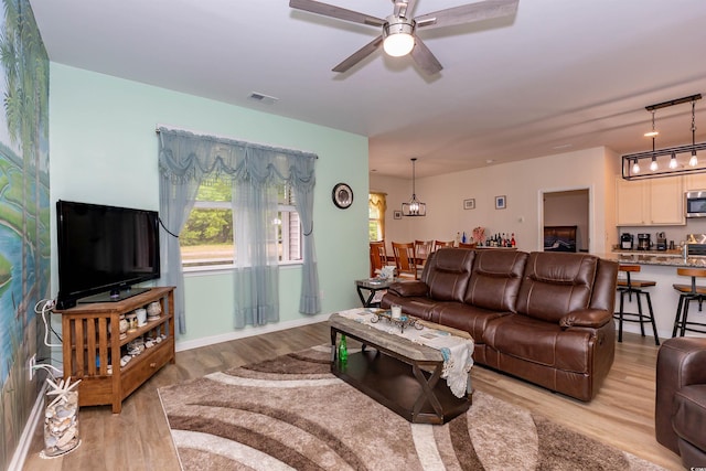 40 Parkside Dr, Pawleys Island, SC 29585 - living area with light wood finished floors and ceiling fan