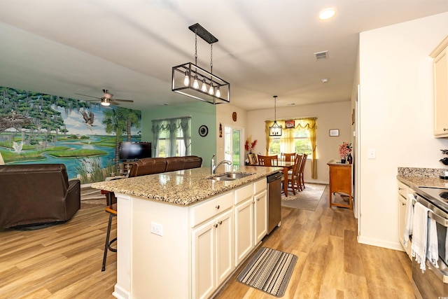 40 Parkside Dr, Pawleys Island, SC 29585 - kitchen with appliances with stainless steel finishes, a sink, healthy amount of natural light, open floor plan, and recessed lighting