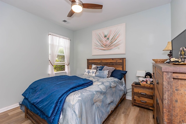 40 Parkside Dr, Pawleys Island, SC 29585 - bedroom with wood finished floors, baseboards, and ceiling fan